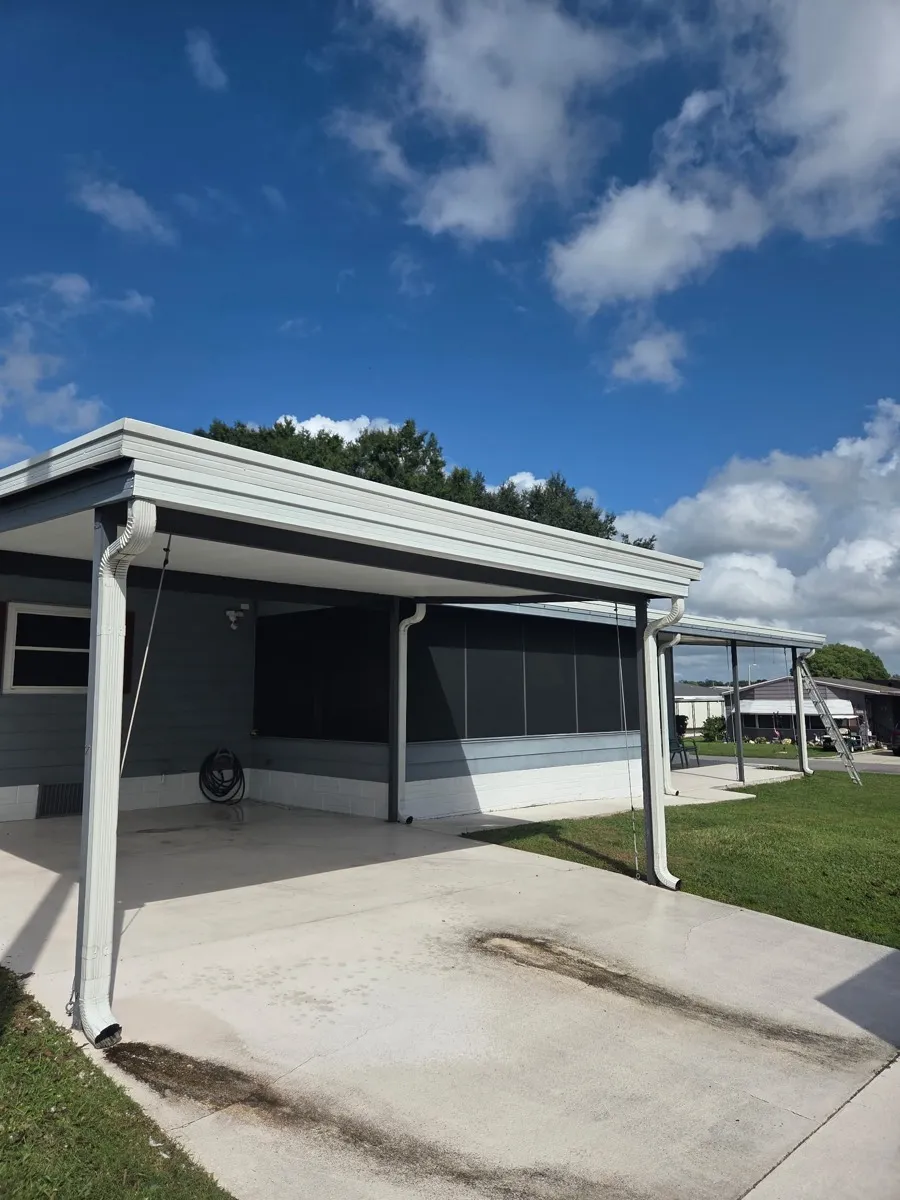 Gutter repair on a screened carport in North Lakeland, Florida.